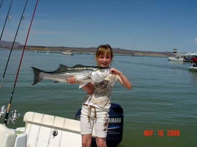 Fishing Guide, Gidget Moon Miller and her beautiful Striped Bass!